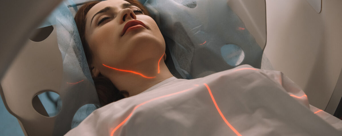 beautiful woman lying on ct scanner bed during tomography test in hospital e1699990793651