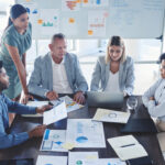 teamwork business meeting and infographic paper for target audience data kpi or demographic chart e1700025600902